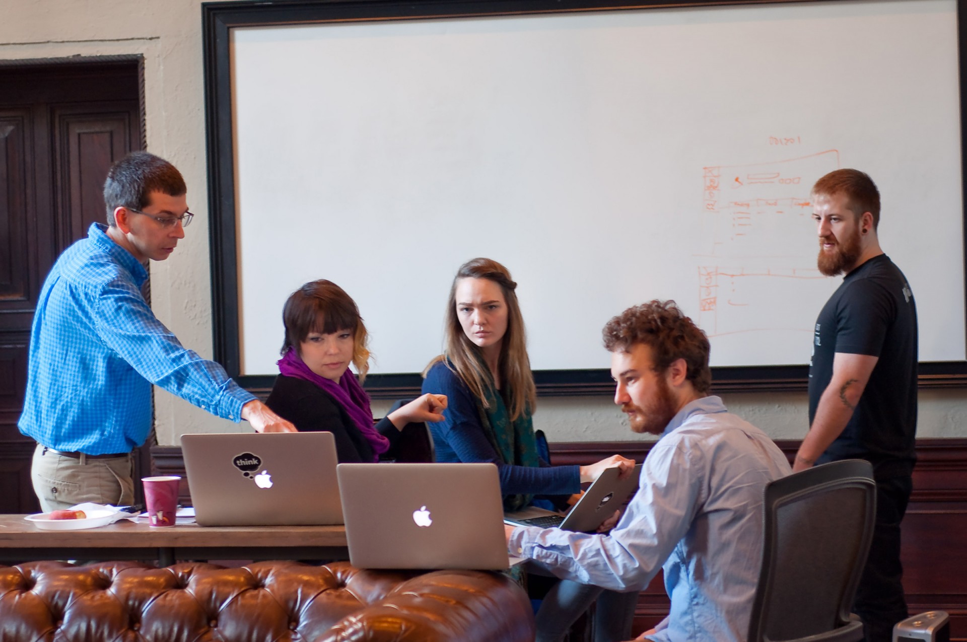 Project Cognoma's Casey Greene, Daniel Himmelstein and Benjamin Dolly working with Think Company volunteers (Photo by Jacqueline Siotto)